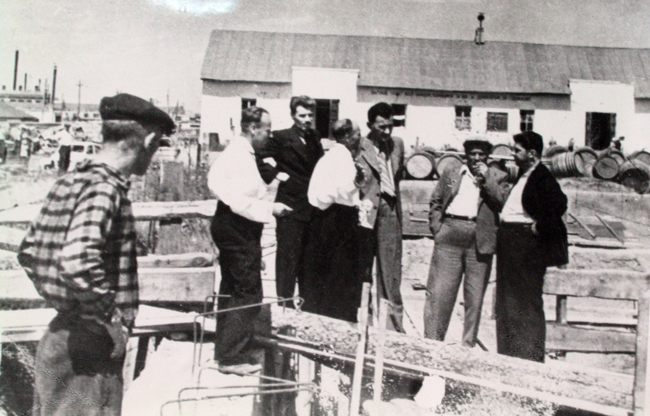 Akhmetovich Dinmukhamed Kunaev at the first brick laying for the construction of champagne factory